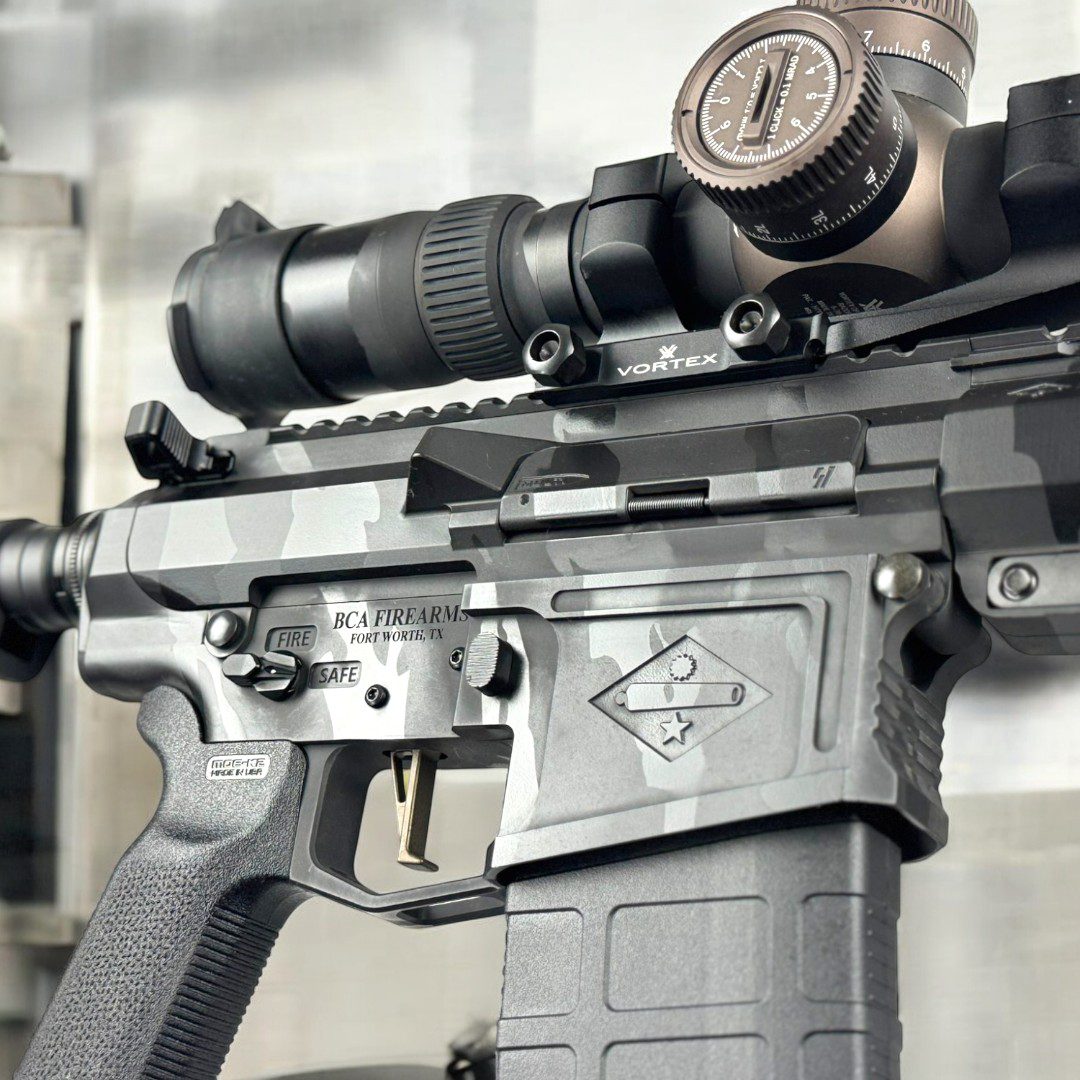 A close look at the 6.5 Creedmoor rifle receiver finished in Obsidian Tiger Stripe, shown with a Vortex Razor HD Gen III and Magpul bipods. Precision, long range rifle, with a match grade carbon fiber barrel, and a 2.5 lb. CMC trigger..